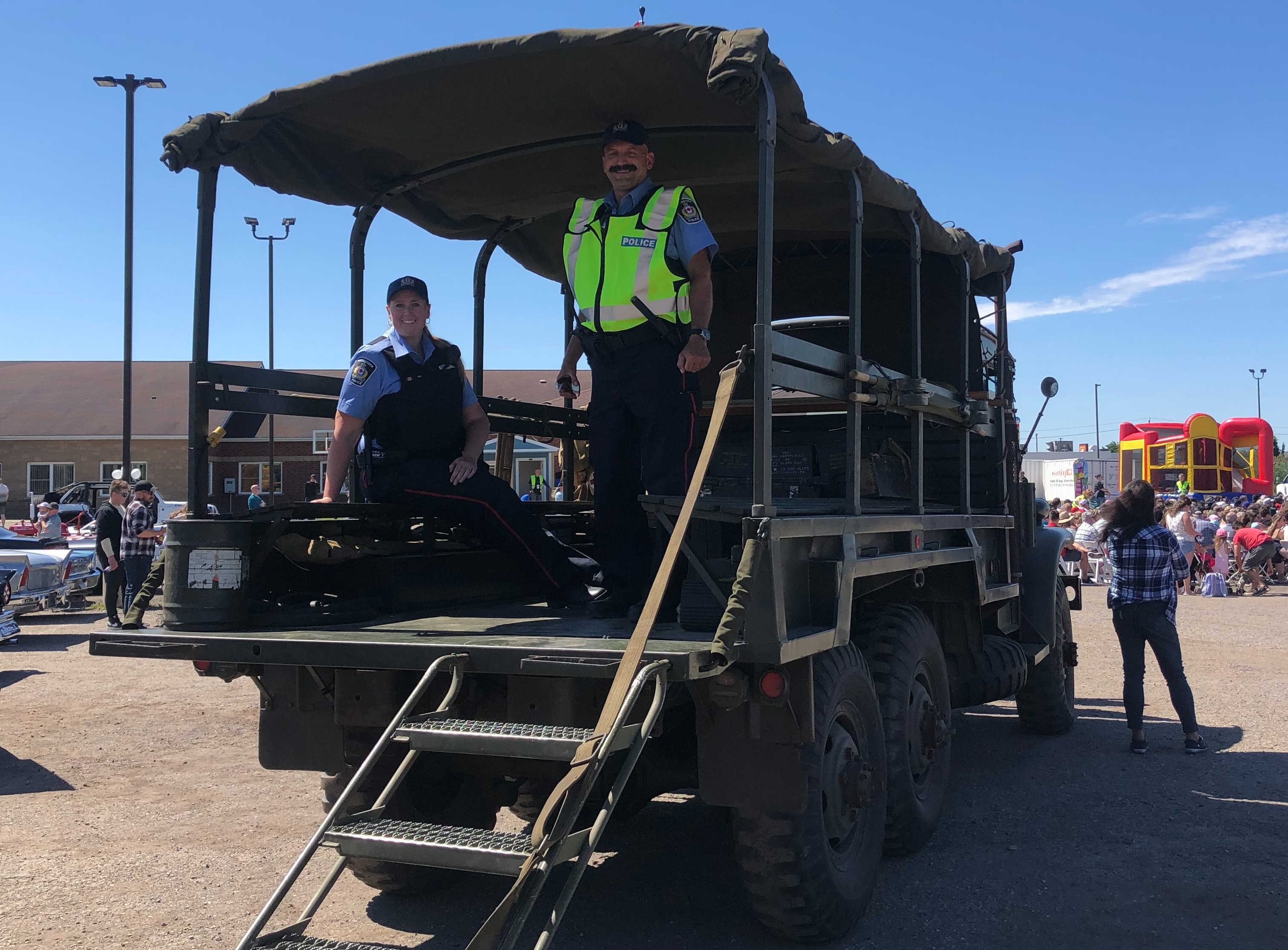 Two Auxiliary members in the back of a truck