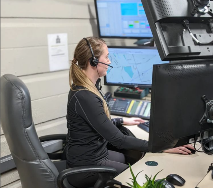 Communications Centre communications dispatcher sitting at their station taking a call